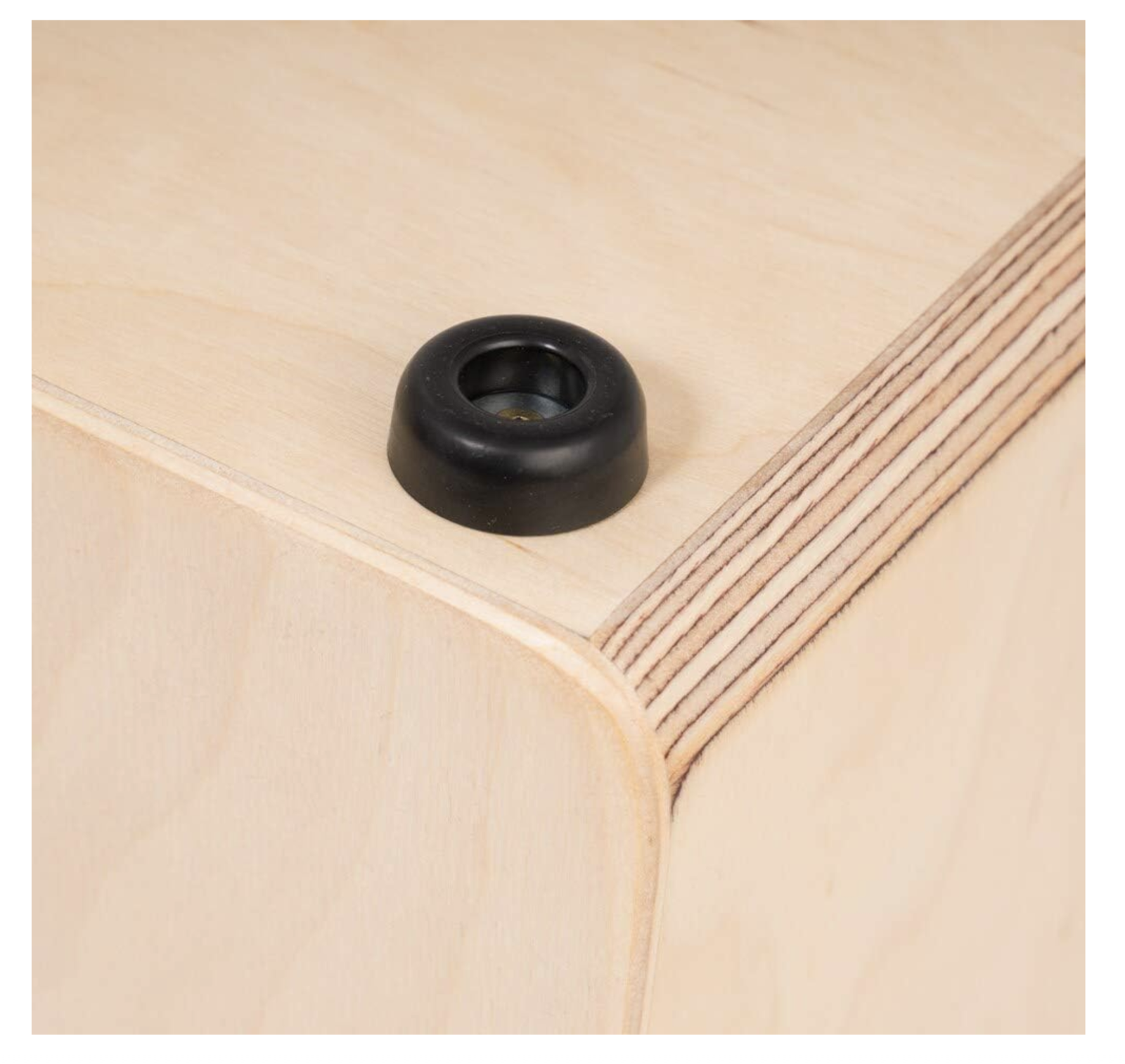 Close detail: rubber foot and birch ply edge banding.